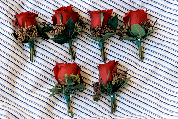 red rose wedding boutonniere photo by Yvette Roman Photography